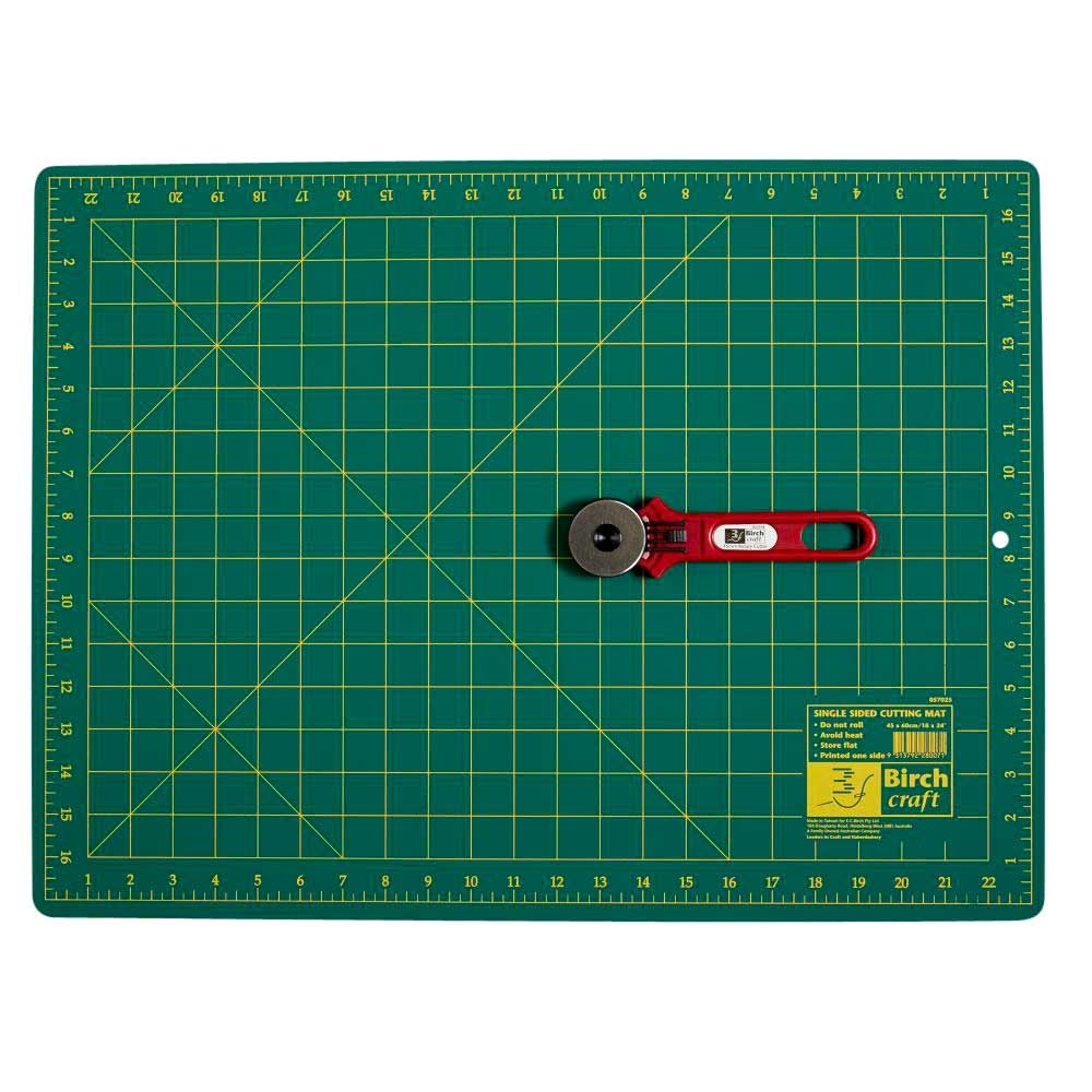 17” x 23” green cutting mat with rotary cutter